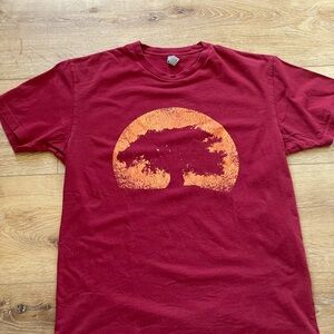 Designed by Humans men’s tee with tree graphic print on front. Size medium.